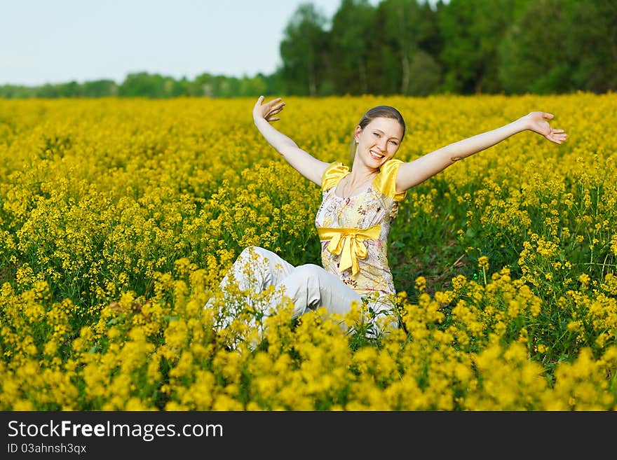 Happy woman on yellow field