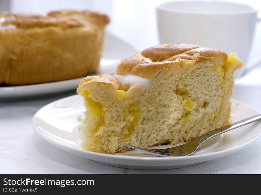 Cake with fork and cup