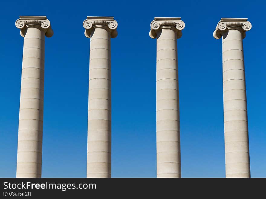 Four massive columns, blue sky