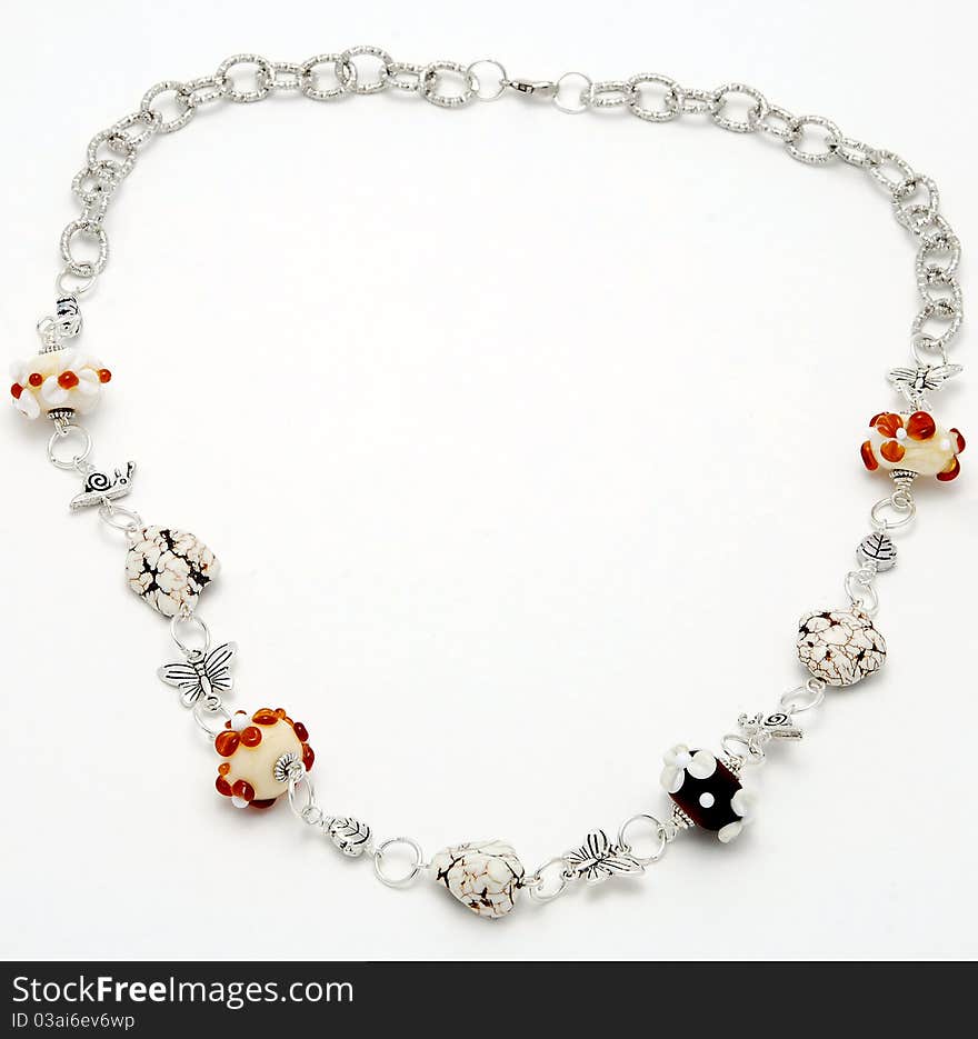 Necklace handmade from Murano glass on a white background