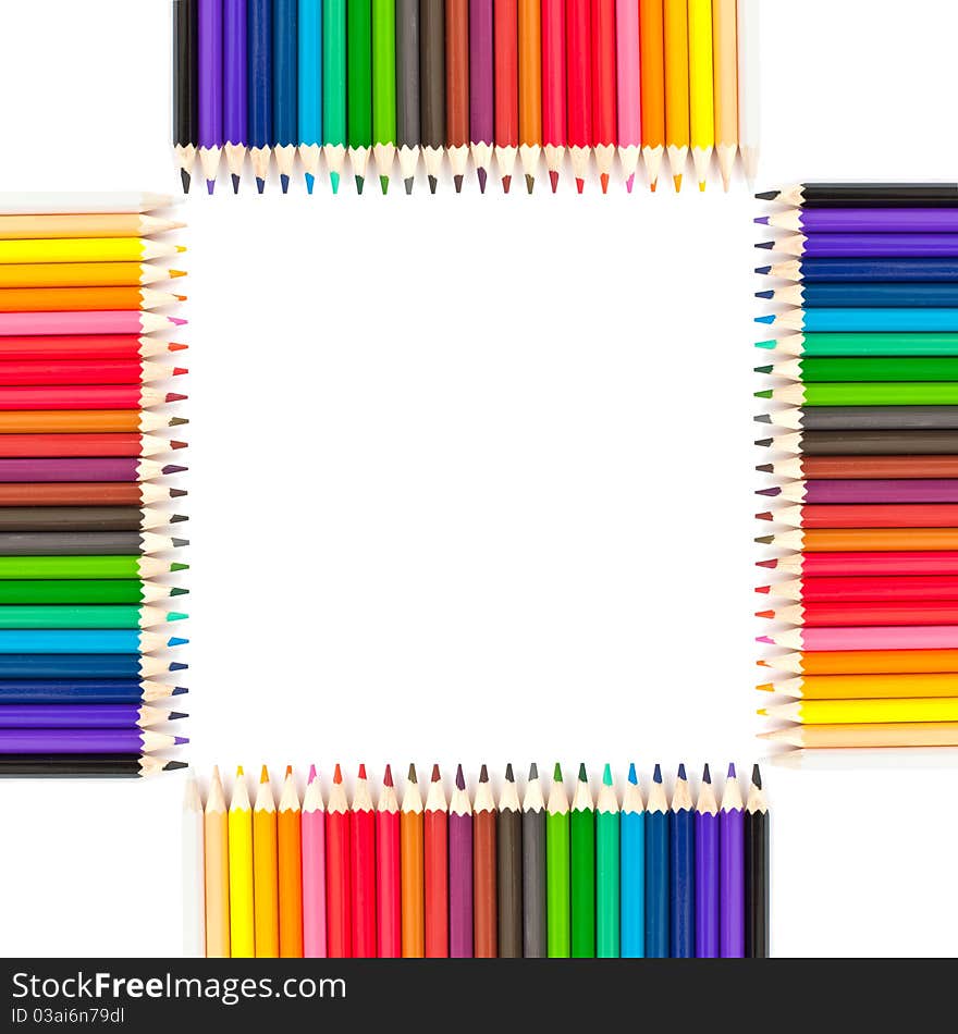 Colored pencils on a white background in a frame