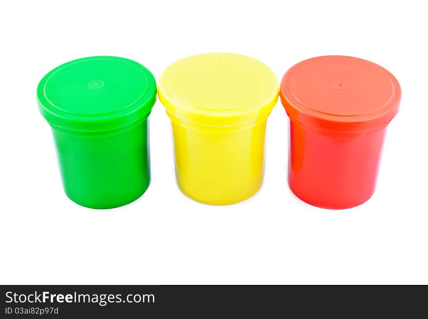 Three colored cans isolated on white background