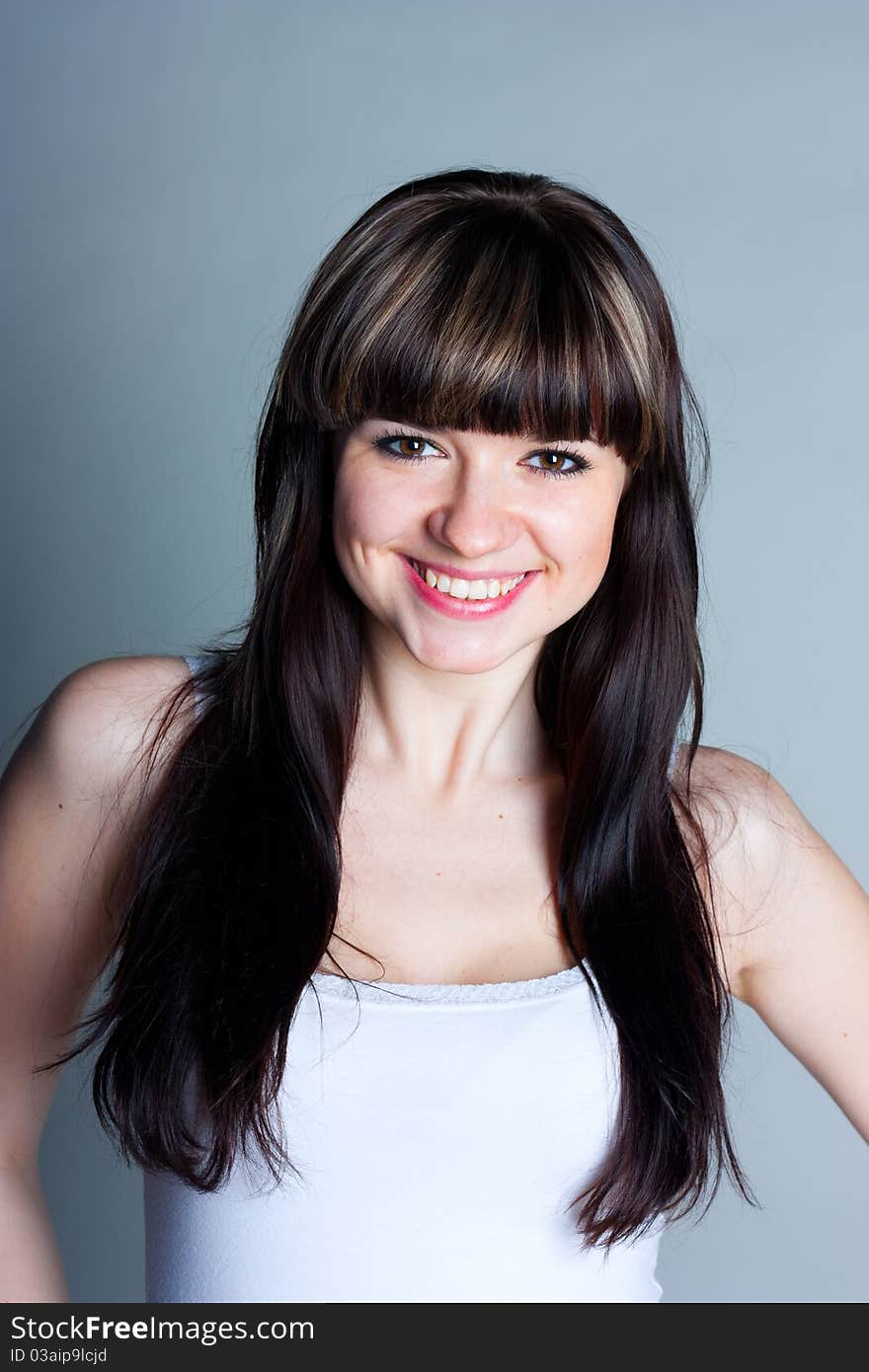 Beautiful girl on a gray background