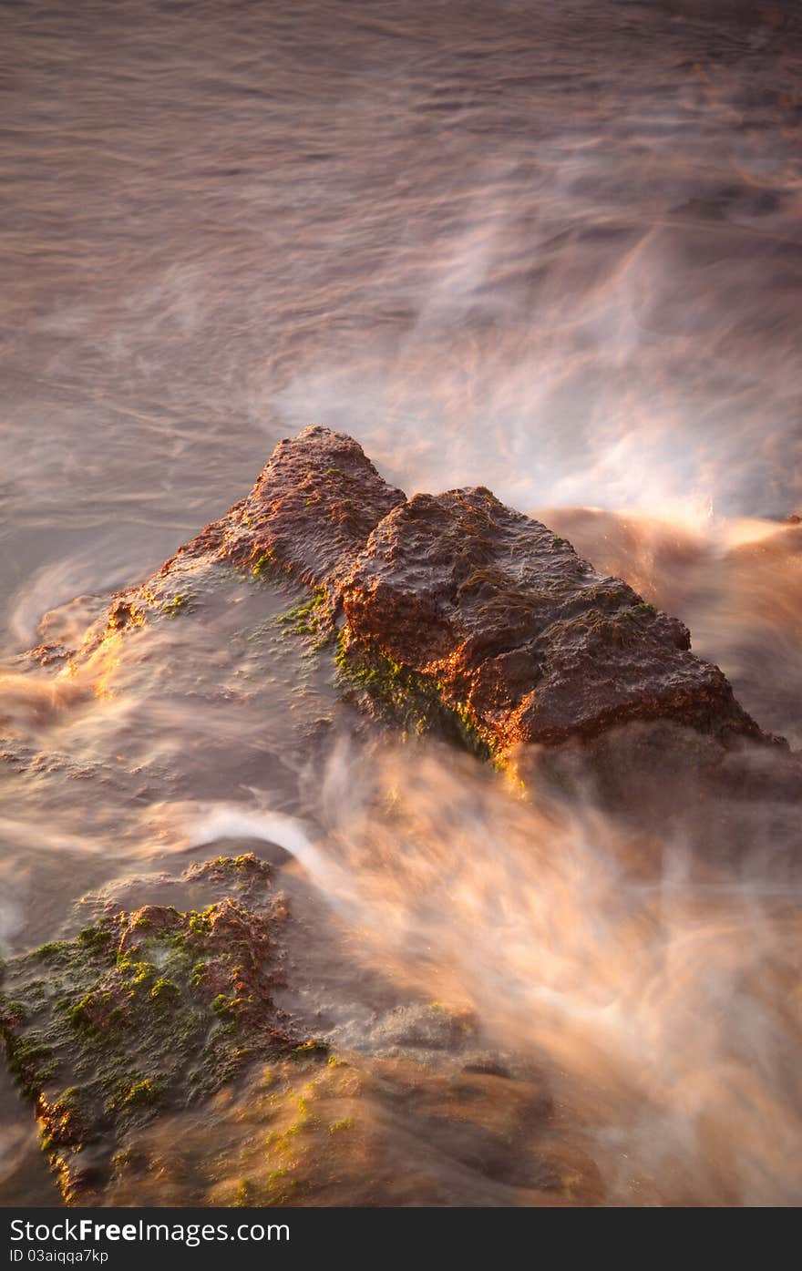 Morning Sea the waves washed reefs