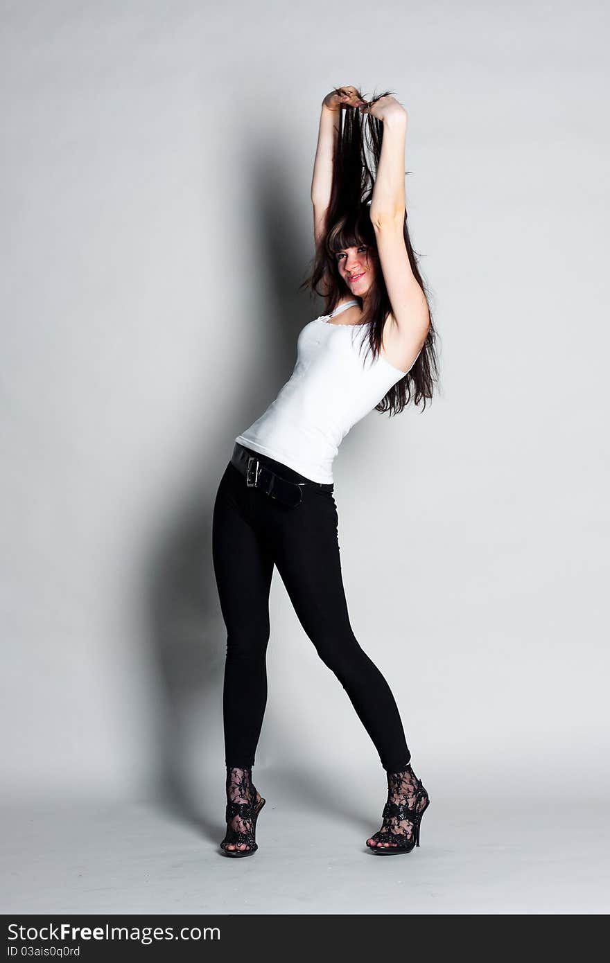 Beautiful girl on a gray background