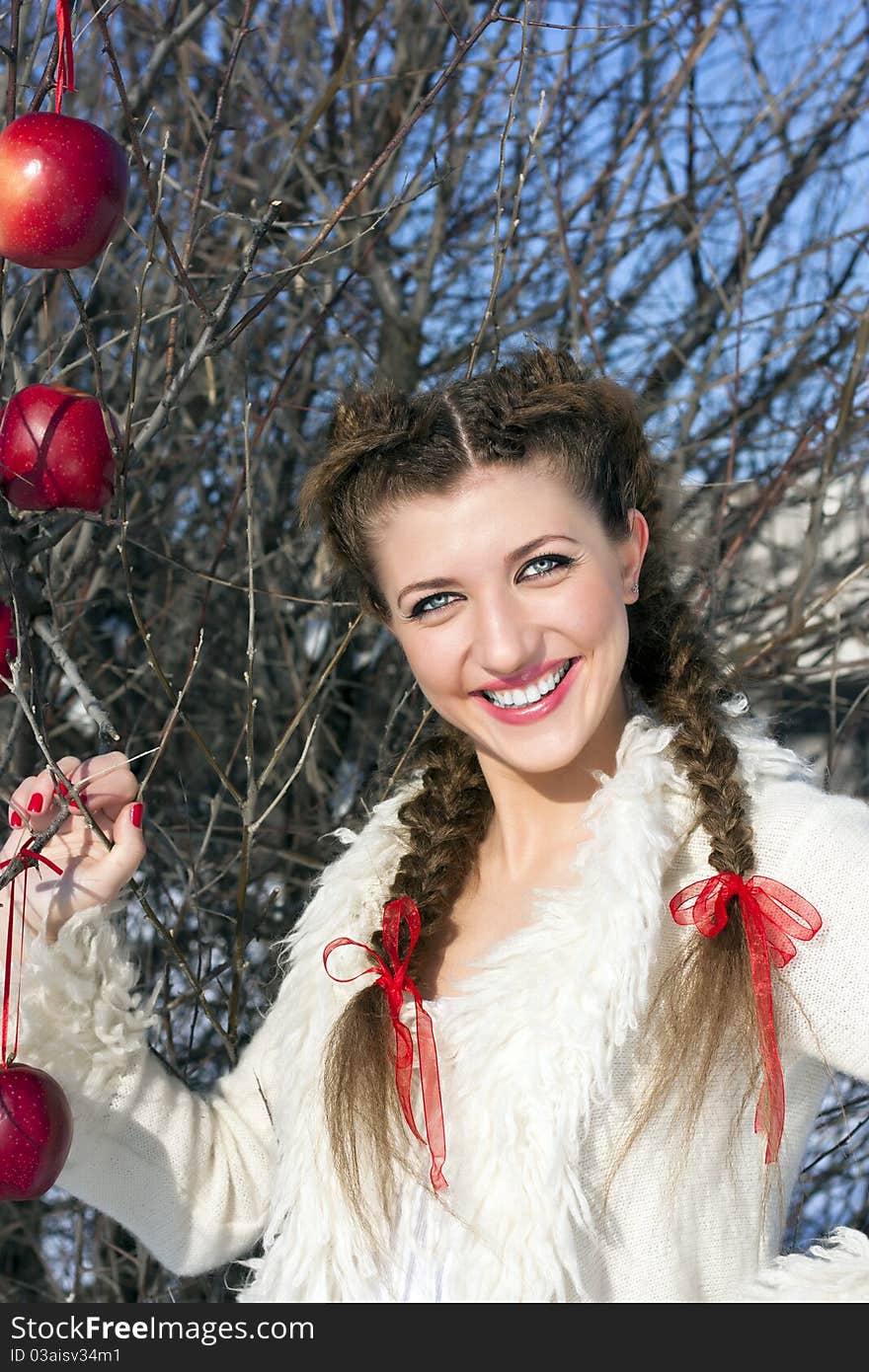 Smiling young woman with red apple. Smiling young woman with red apple