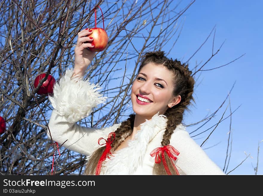 Smiling young woman with red apple. Smiling young woman with red apple