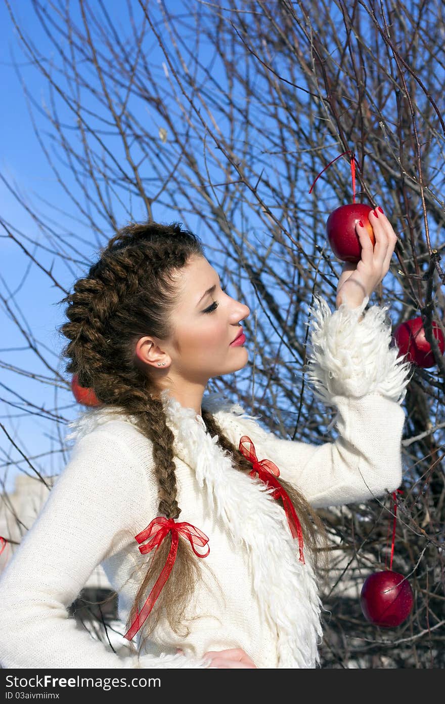 Portrait of beautiful young girl in winter day