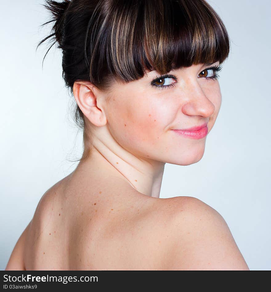 Beautiful girl on a gray background