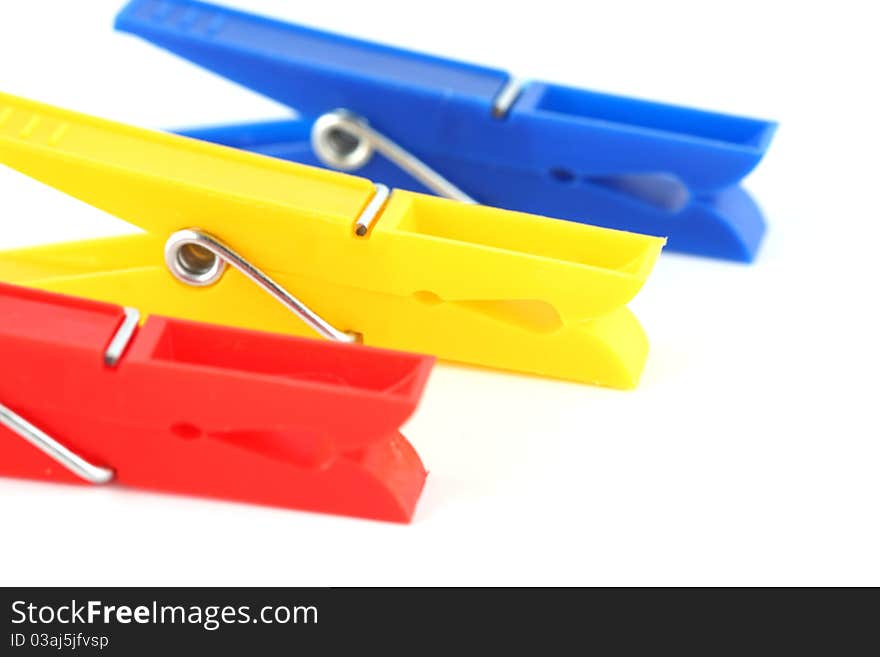 Colored clothespins isolated on white background