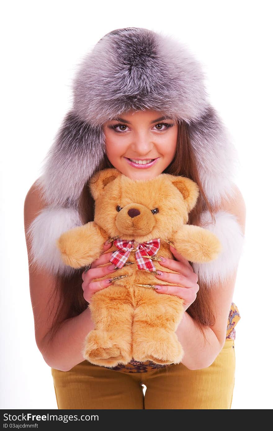 Beautiful longhair girl is holding the teddy bear. Beautiful longhair girl is holding the teddy bear