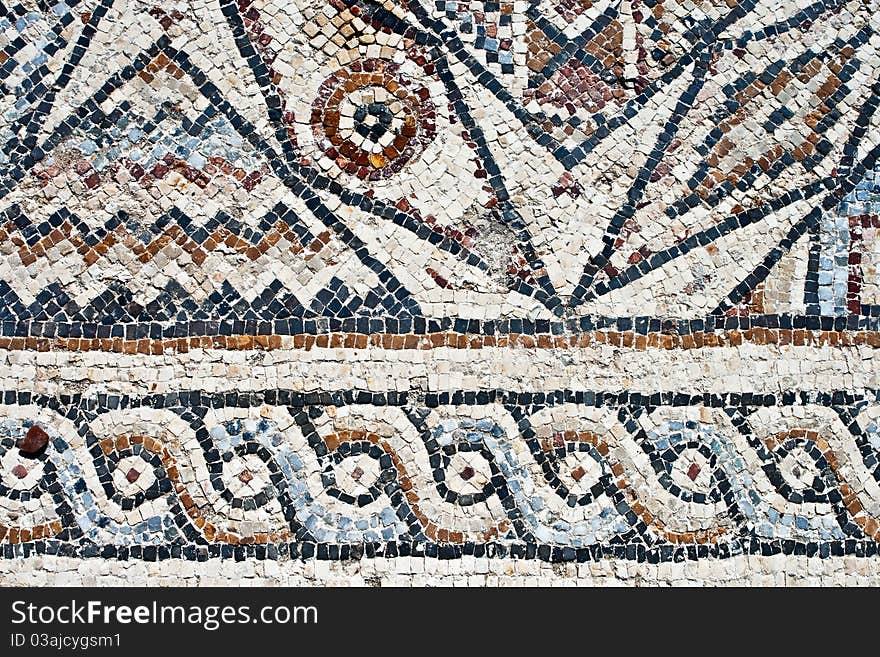 Fragment of an ancient geometrical colorful floor mosaic in Herod`s Palace. Caesarea, Israel. Fragment of an ancient geometrical colorful floor mosaic in Herod`s Palace. Caesarea, Israel