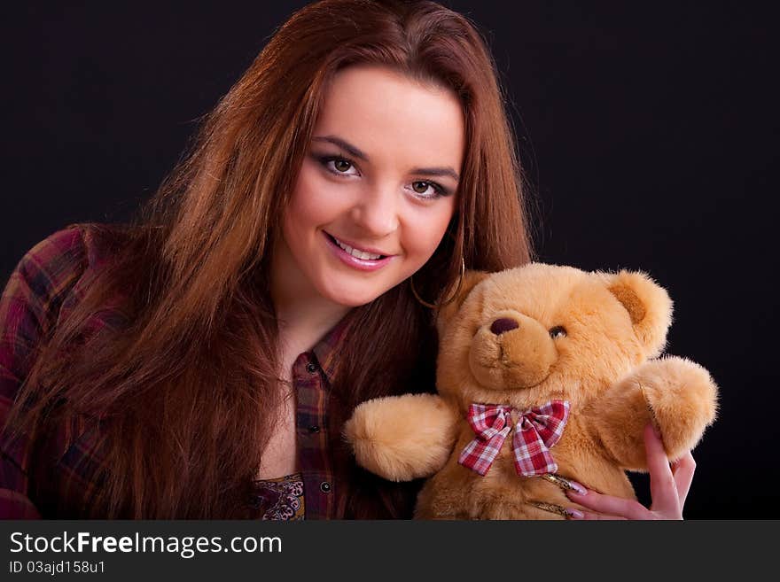 Beautiful longhair girl is holding the teddy bear. Beautiful longhair girl is holding the teddy bear