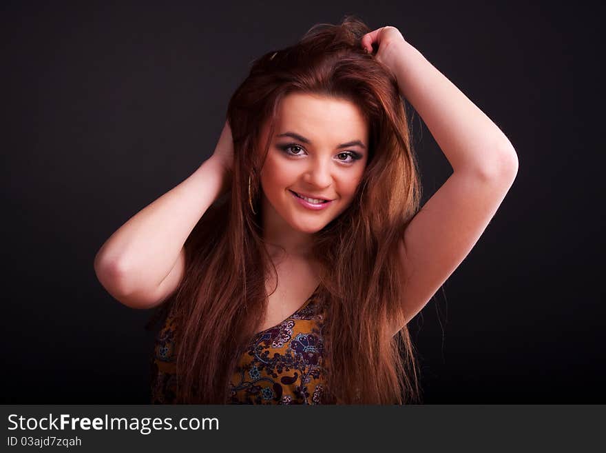 Beautiful young longhair brunette in a romantic pose. Beautiful young longhair brunette in a romantic pose