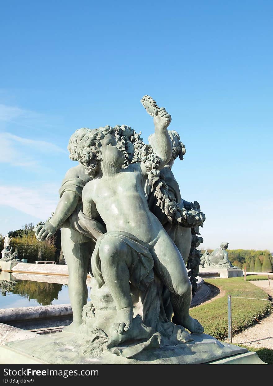 Boy and Pigeon Statue at Versailles castle in France . Boy and Pigeon Statue at Versailles castle in France .