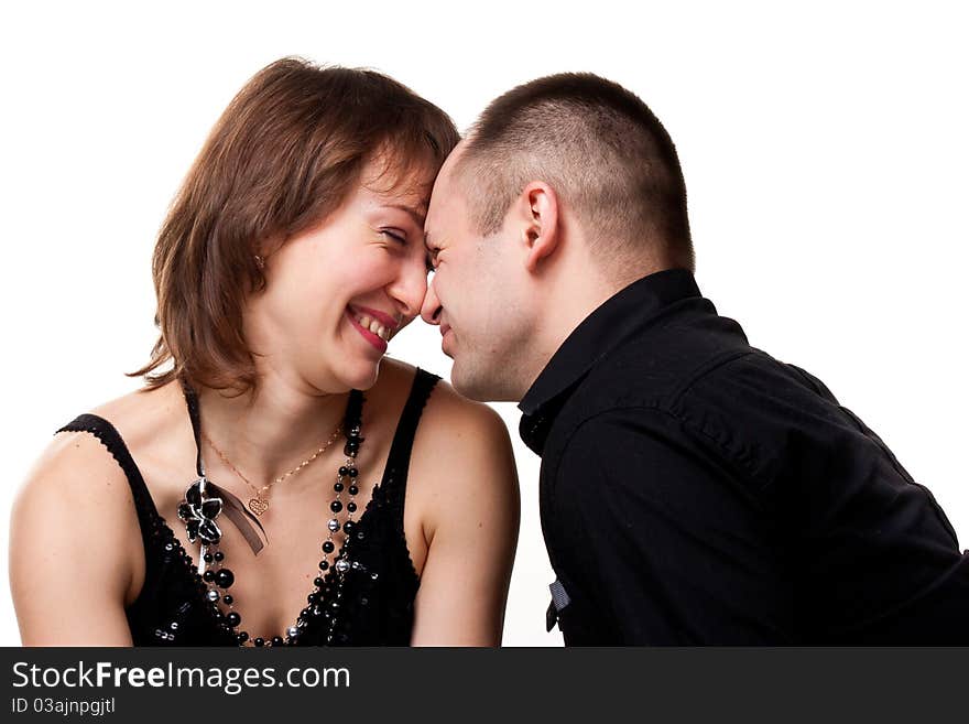 Portrait of a beautiful young happy smiling couple isolated on white