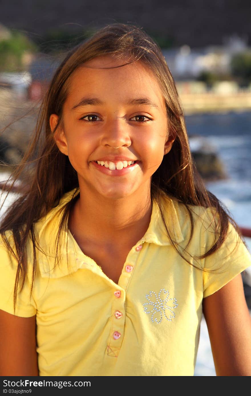 Young girl cute windswept smile late afternoon