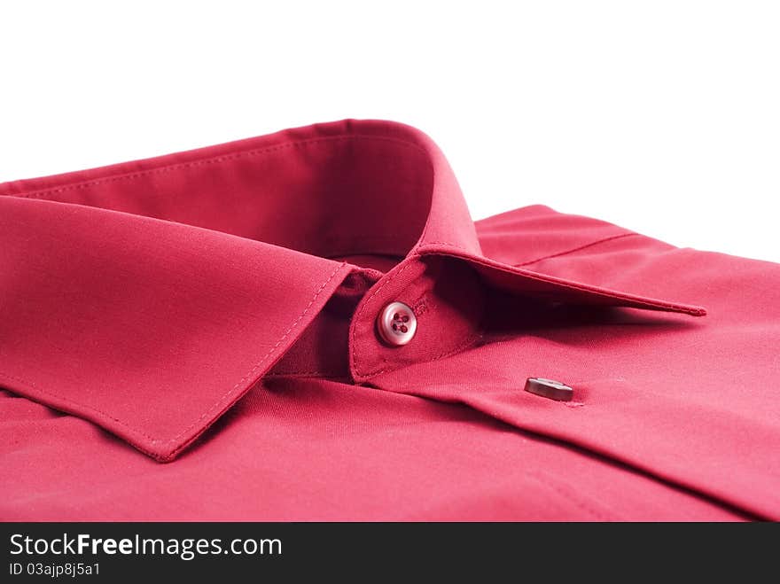 Fastened red shirt on a white background