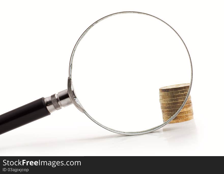 Coins increased magnifying glass isolated on white background