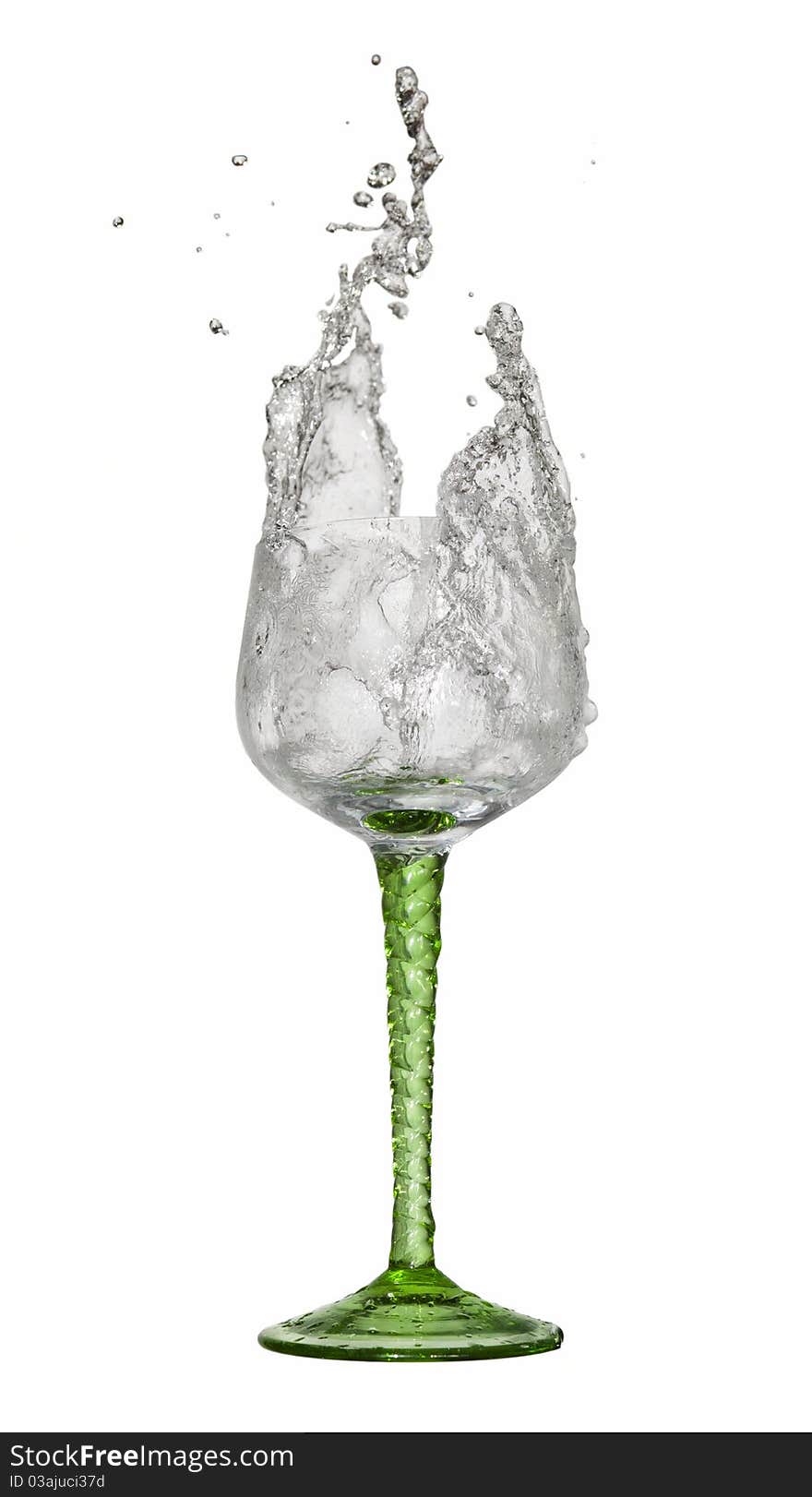 Water splashing out of a glass on white background