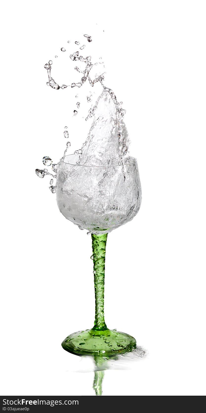 Water splashing out of a glass on white background