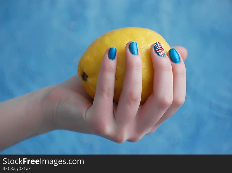 Hand with manicure in British Flag stile. Hand with manicure in British Flag stile