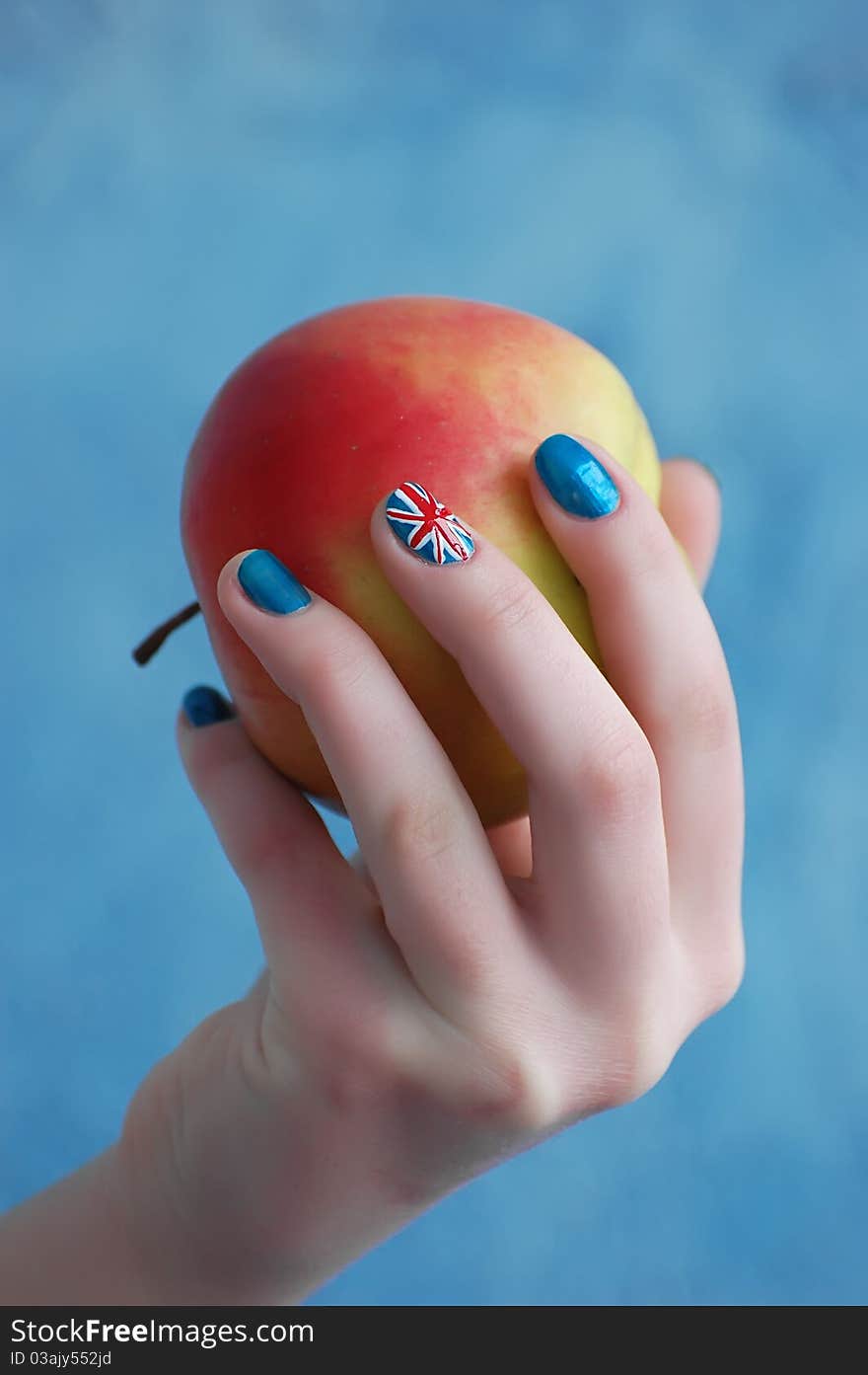 Hand with manicure in British Flag stile. Hand with manicure in British Flag stile