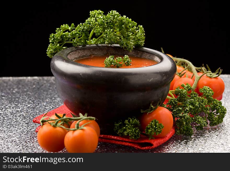 Photo of delicious tomatoe sauce with parsley on red cloth
