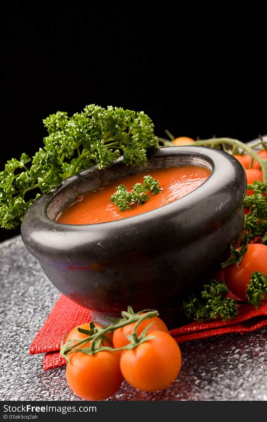 Photo of delicious tomatoe sauce with parsley on red cloth