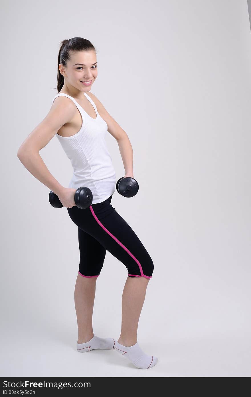 trainer exercising with dumbbell