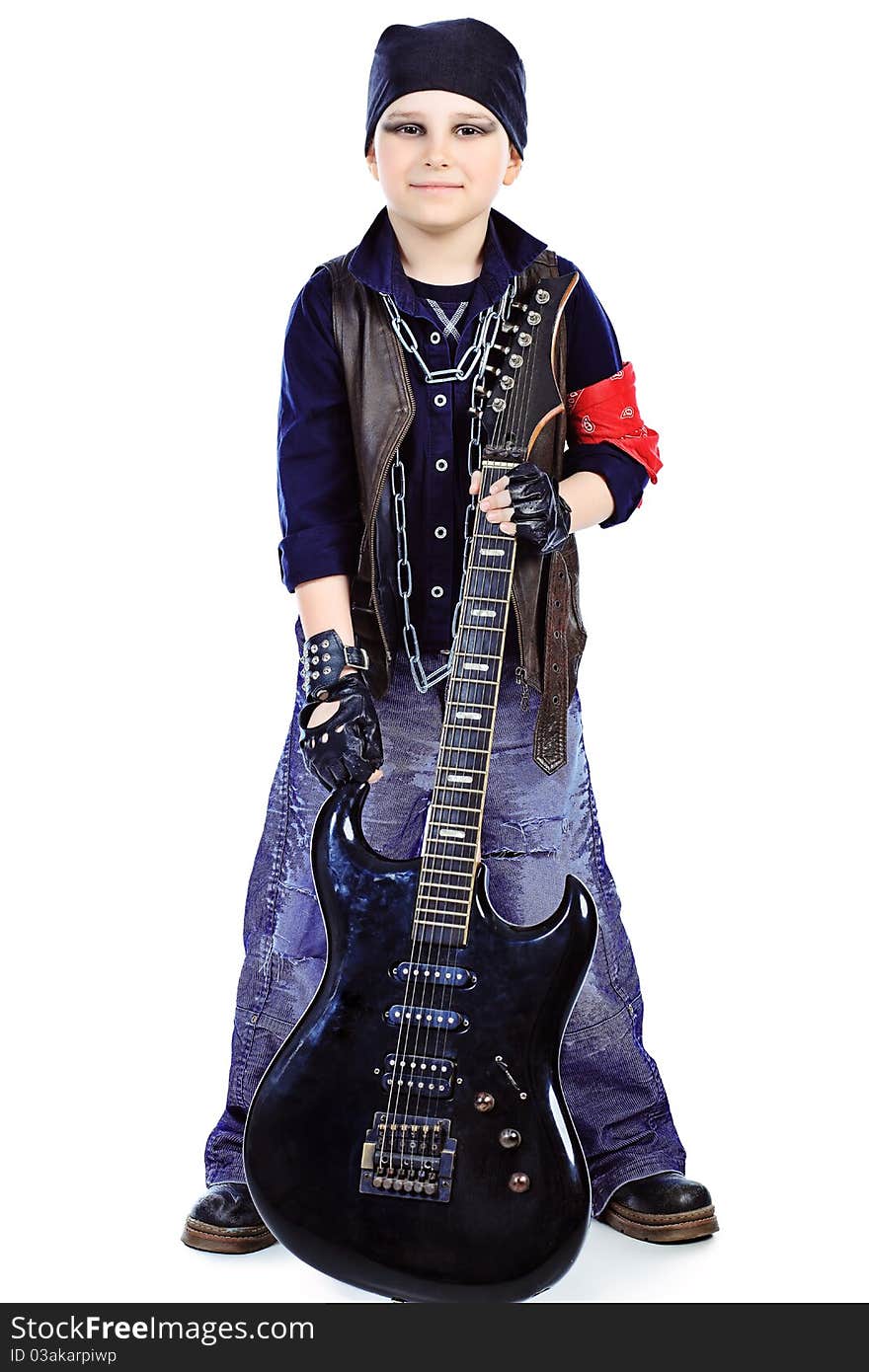 Shot of a little boy playing rock music with electric guitar. Isolated over white background. Shot of a little boy playing rock music with electric guitar. Isolated over white background.