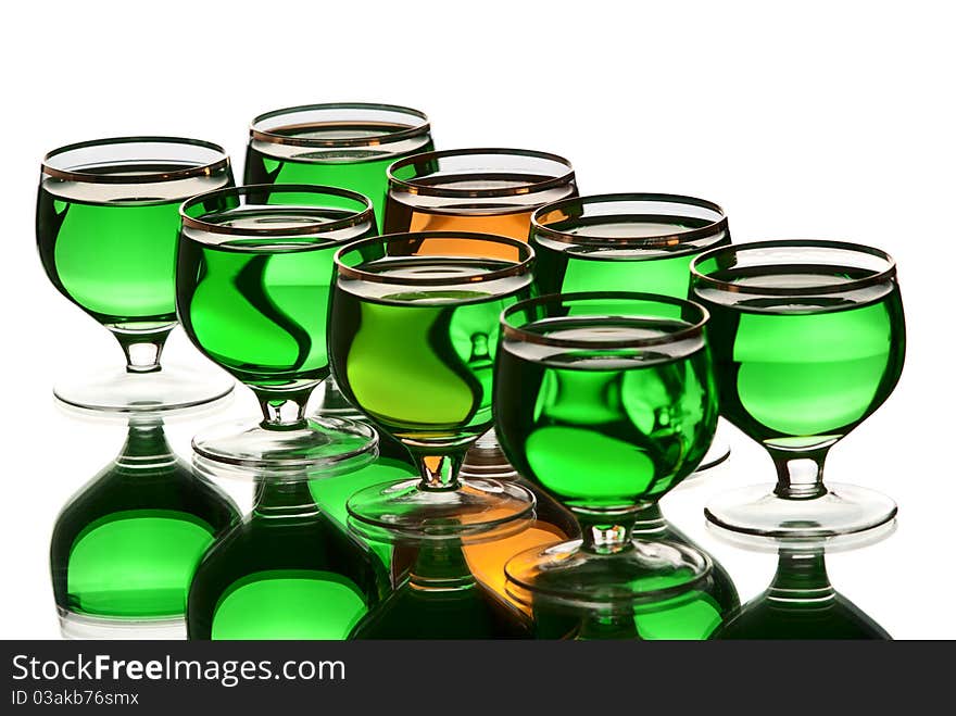 Glasses with alcohol. White background. Studio shot.