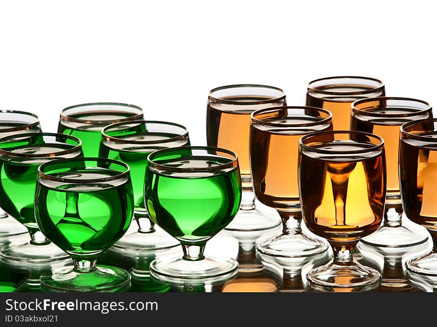 Glasses with alcohol. White background. Studio shot.