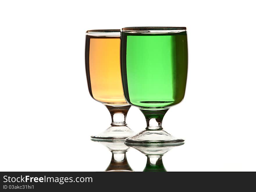 Glasses with alcohol. White background. Studio shot.