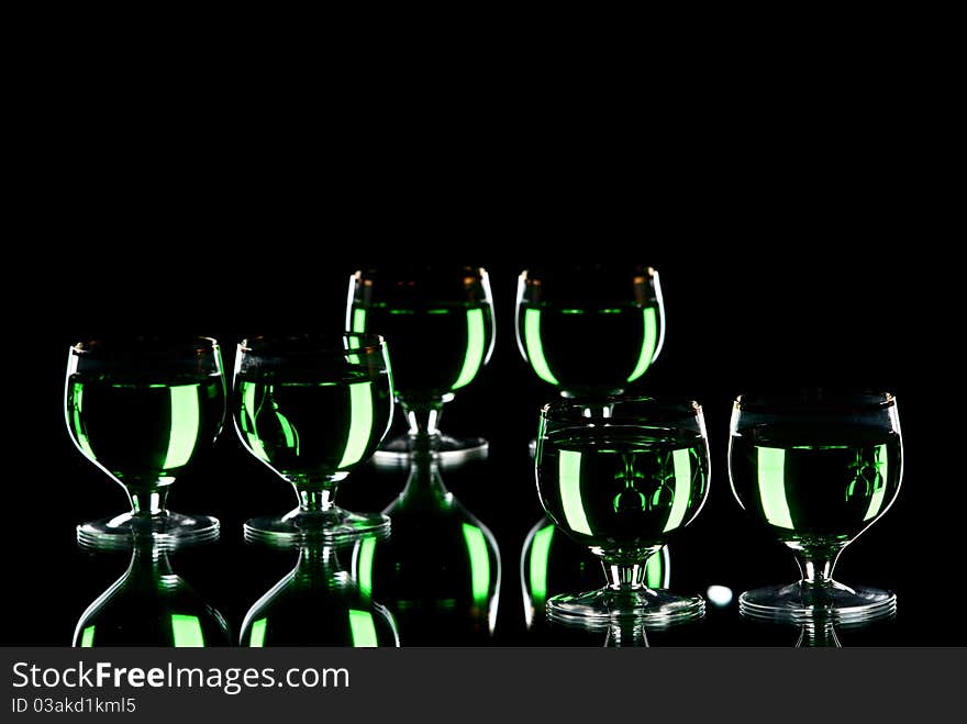 Glasses with alcohol. White background. Studio shot.