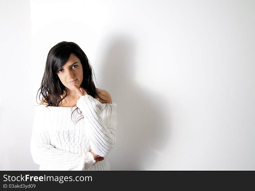 Black hair woman in white on a white background. Black hair woman in white on a white background