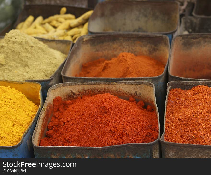 Colorful powdered indian spices at the marked. Colorful powdered indian spices at the marked