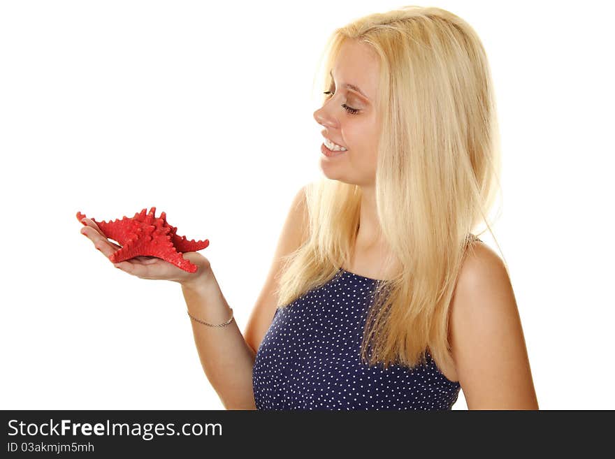 Close-up of an attractive young woman holding a red starfish. Remembers about the rest. Isolated on white. Close-up of an attractive young woman holding a red starfish. Remembers about the rest. Isolated on white