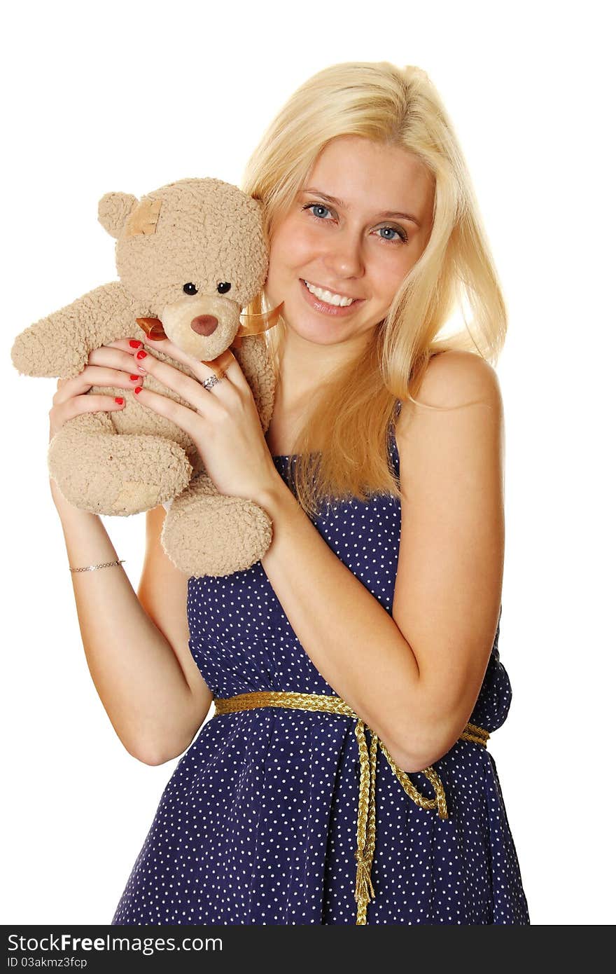 Young attractive woman holding in the arms of Teddy.  Isolated on white. Young attractive woman holding in the arms of Teddy.  Isolated on white