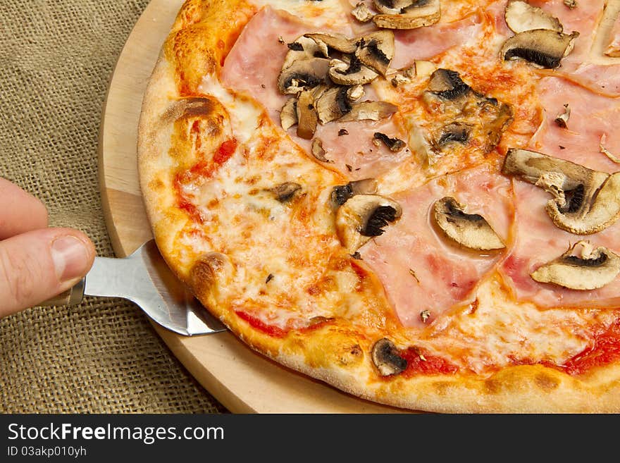 Italian pizza with ham and mushroom