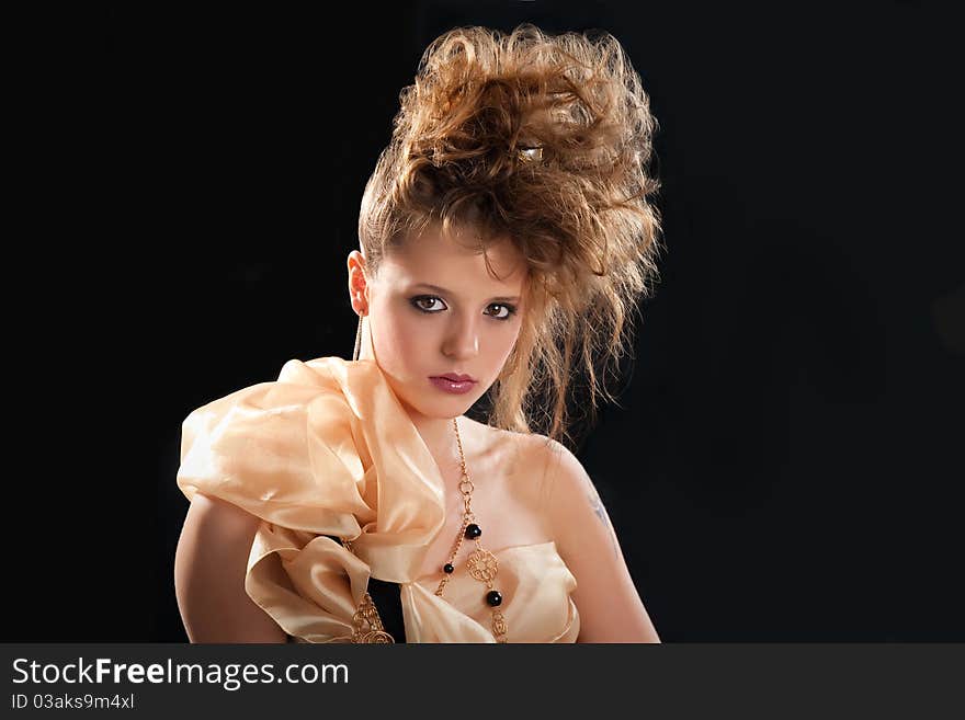 Young woman glamor portrait on black background