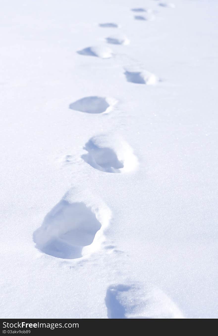 Footstep on snow. Conceptual composition.