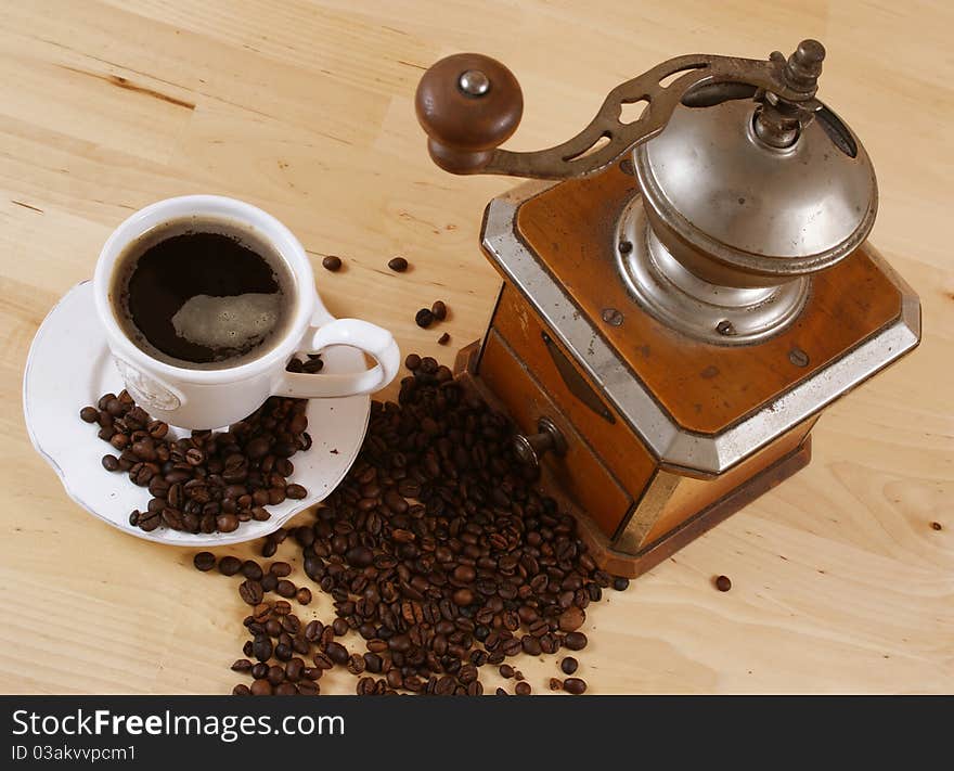 Black coffee and a coffee grinder. Black coffee and a coffee grinder.