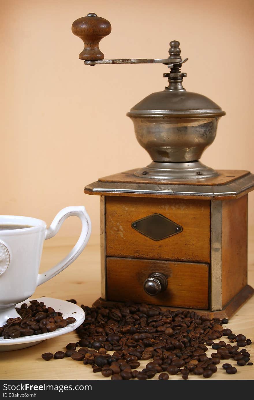 Black coffee and a coffee grinder. Black coffee and a coffee grinder.