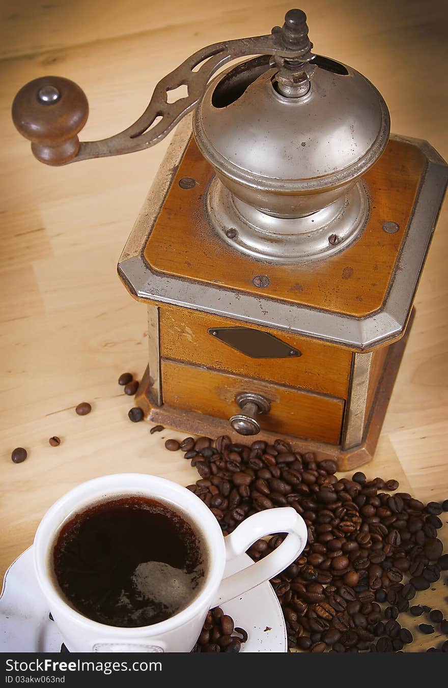 Black coffee and a coffee grinder. Black coffee and a coffee grinder.