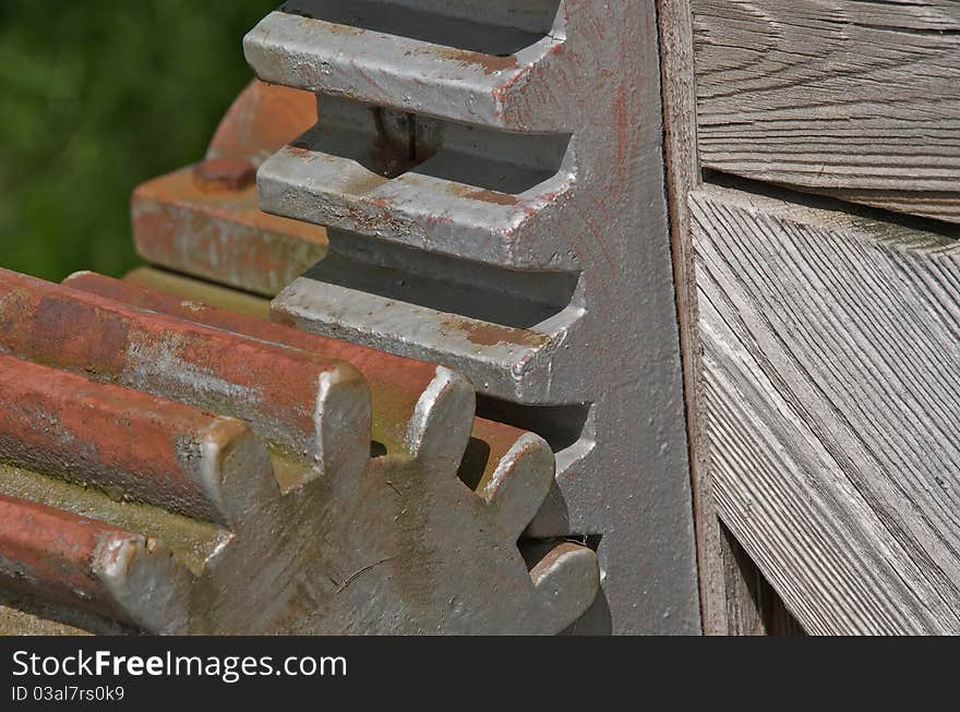 Shot of gears used for lifting a water gate on an autumn day. Shot of gears used for lifting a water gate on an autumn day.