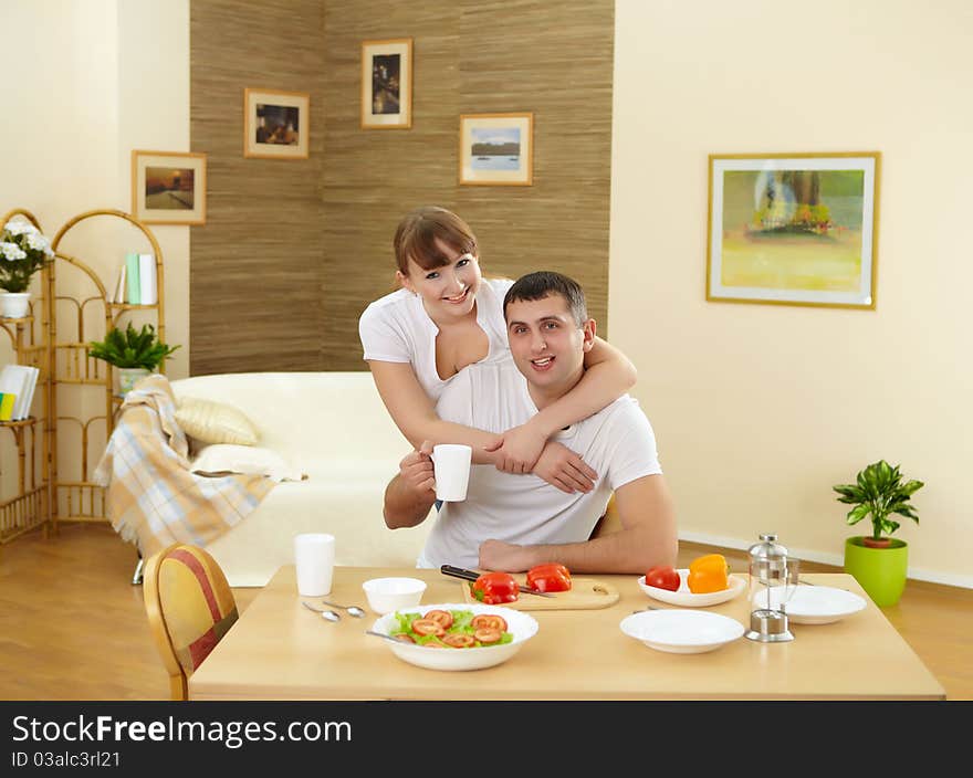 Young couple in love at home eating together and having fun. Young couple in love at home eating together and having fun