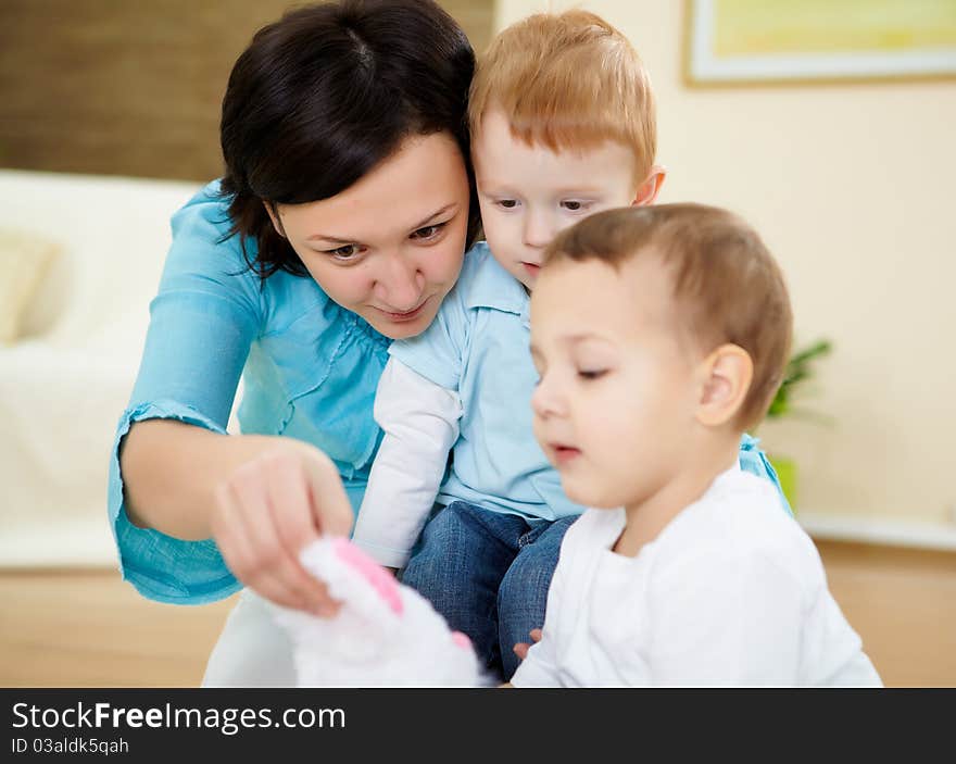 Mother and son at home on the floor