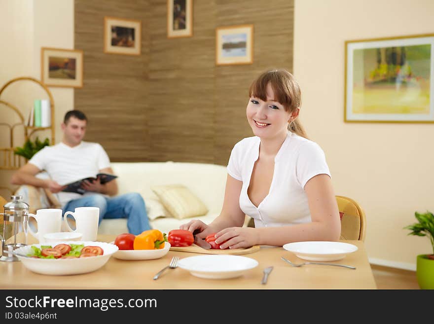 A young girl cooking healthy food at home. A young girl cooking healthy food at home