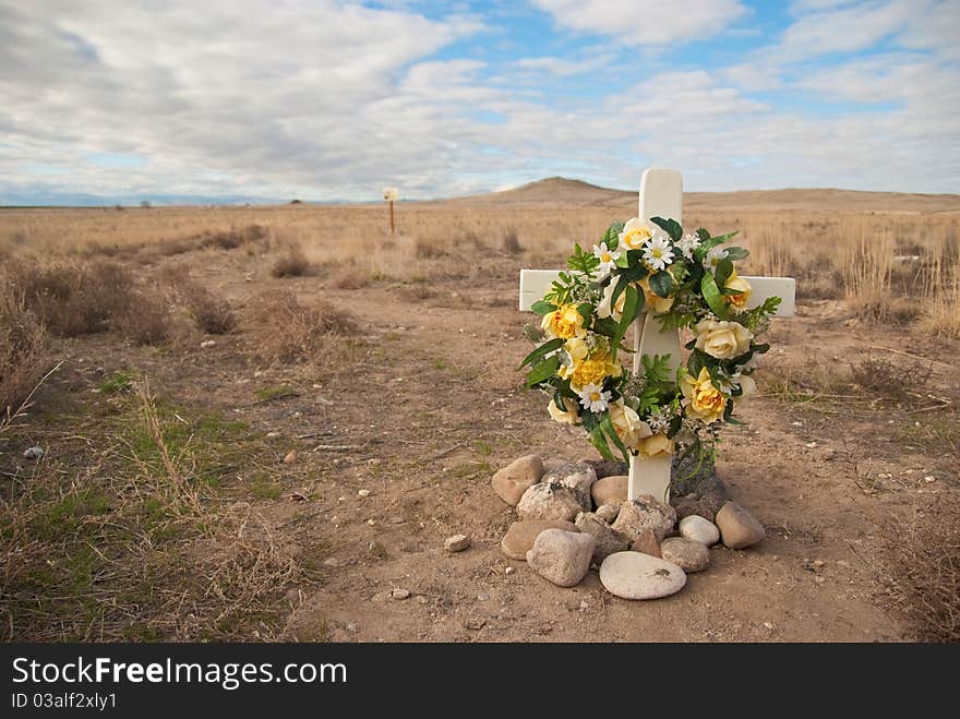 A flower filled roadside rememberance site.